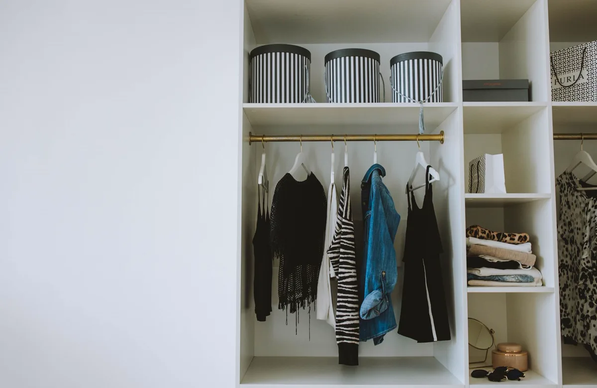 A closet with everything on a hanger or a shelf, and room to spare