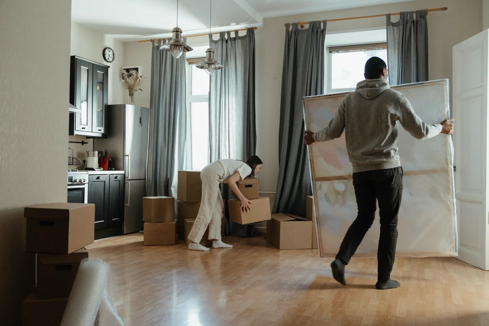 Unpacking labeled boxes in a new, smaller home